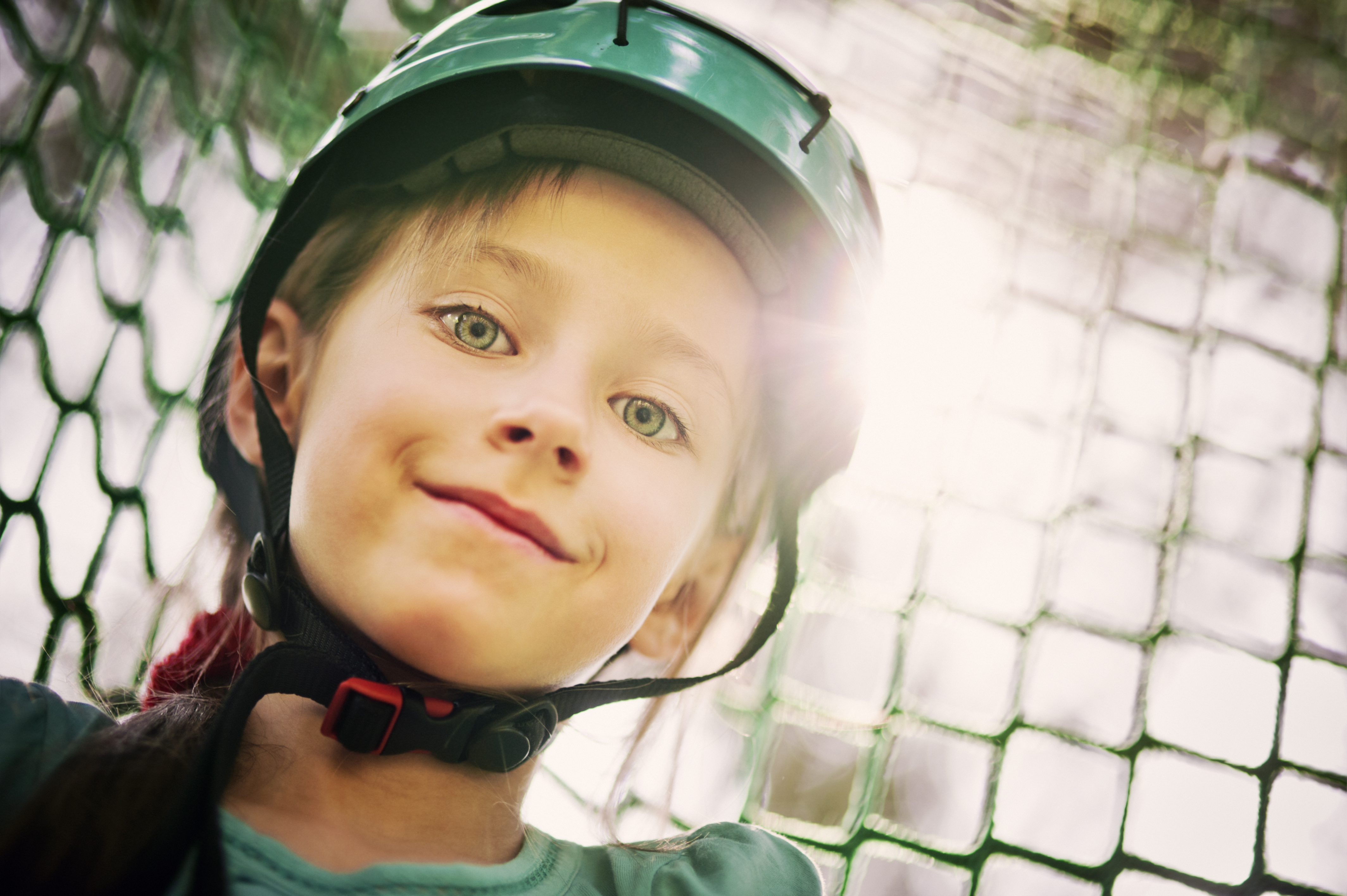 Portrait of a child wearing a protective helmet outdoors