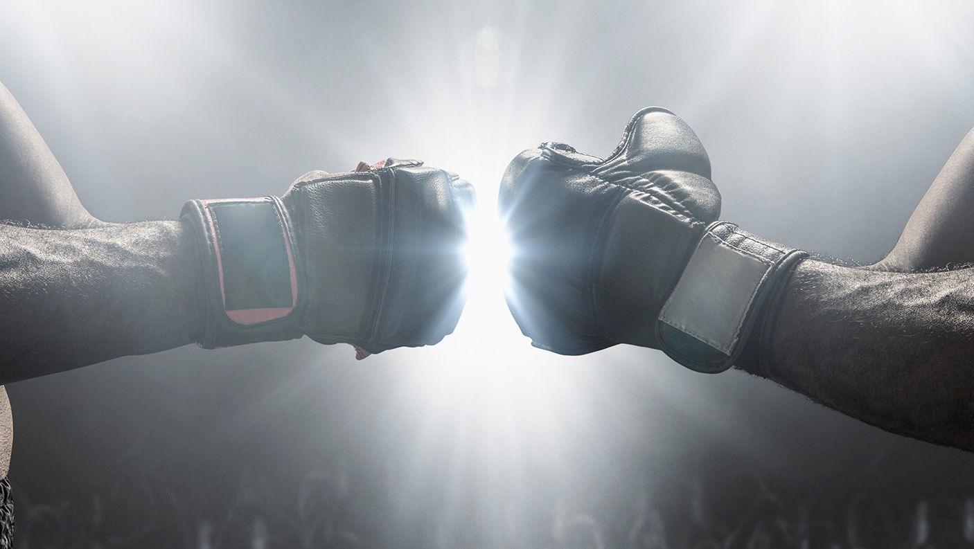 Two boxing gloved hands bumping fists
