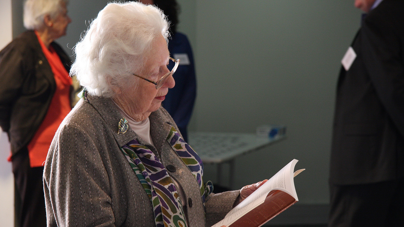 Margaret Medcalf reading a document