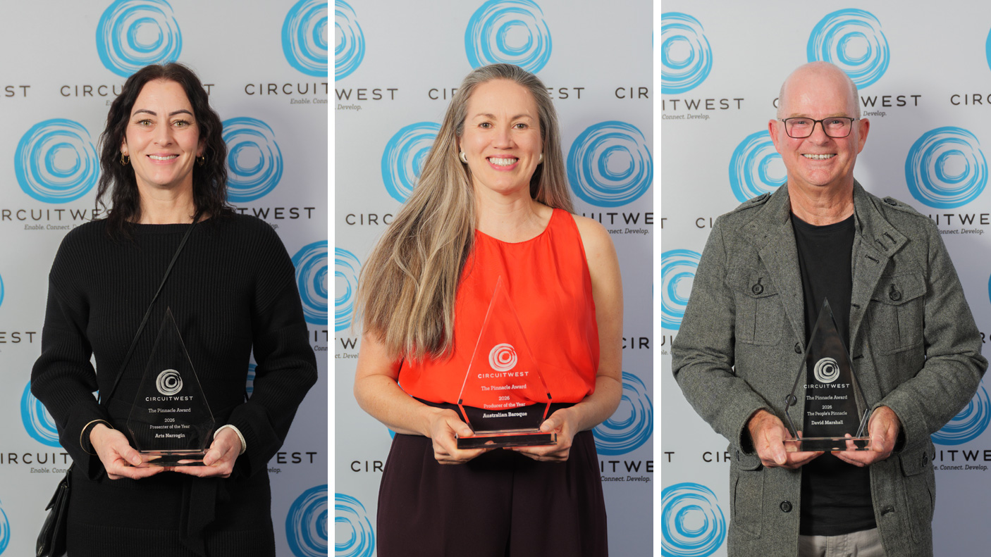 three Pinacle award winners with their awards.