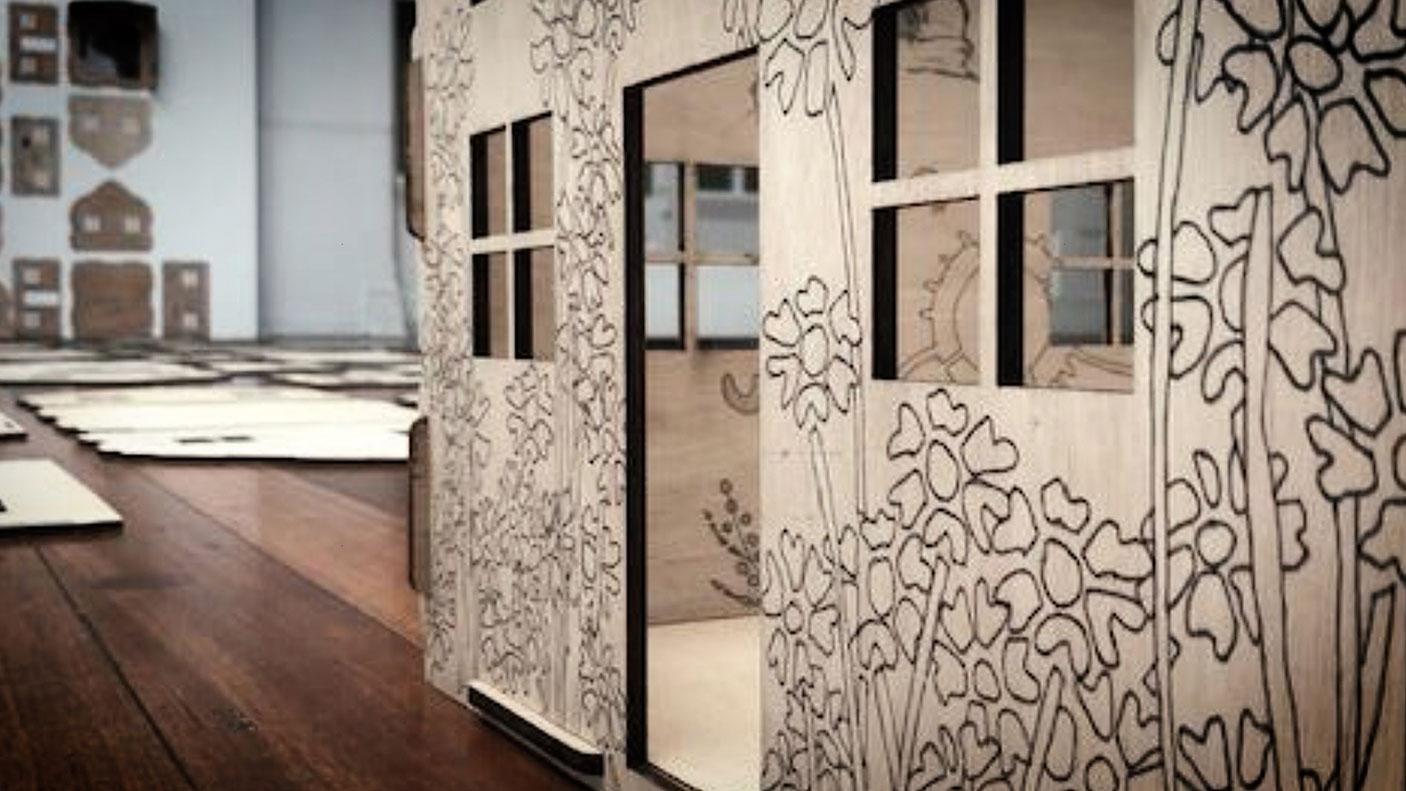 A sculpture of a decorated house shape from the Street to Street exhibition