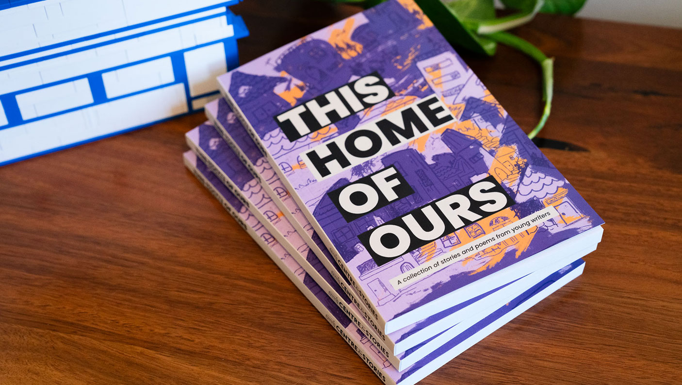 A stack of books titled "This home of ours".