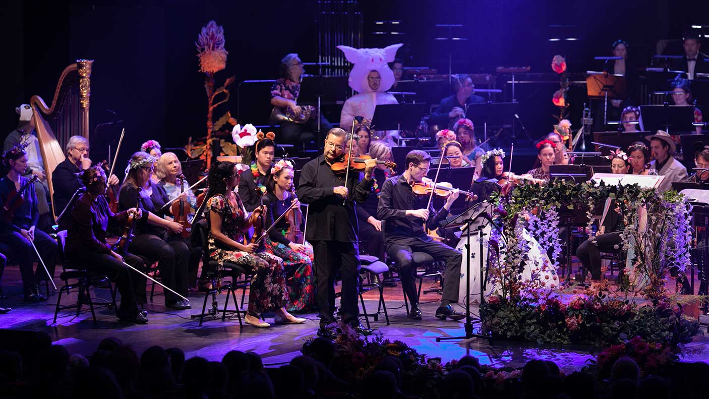 A symphony performing on stage