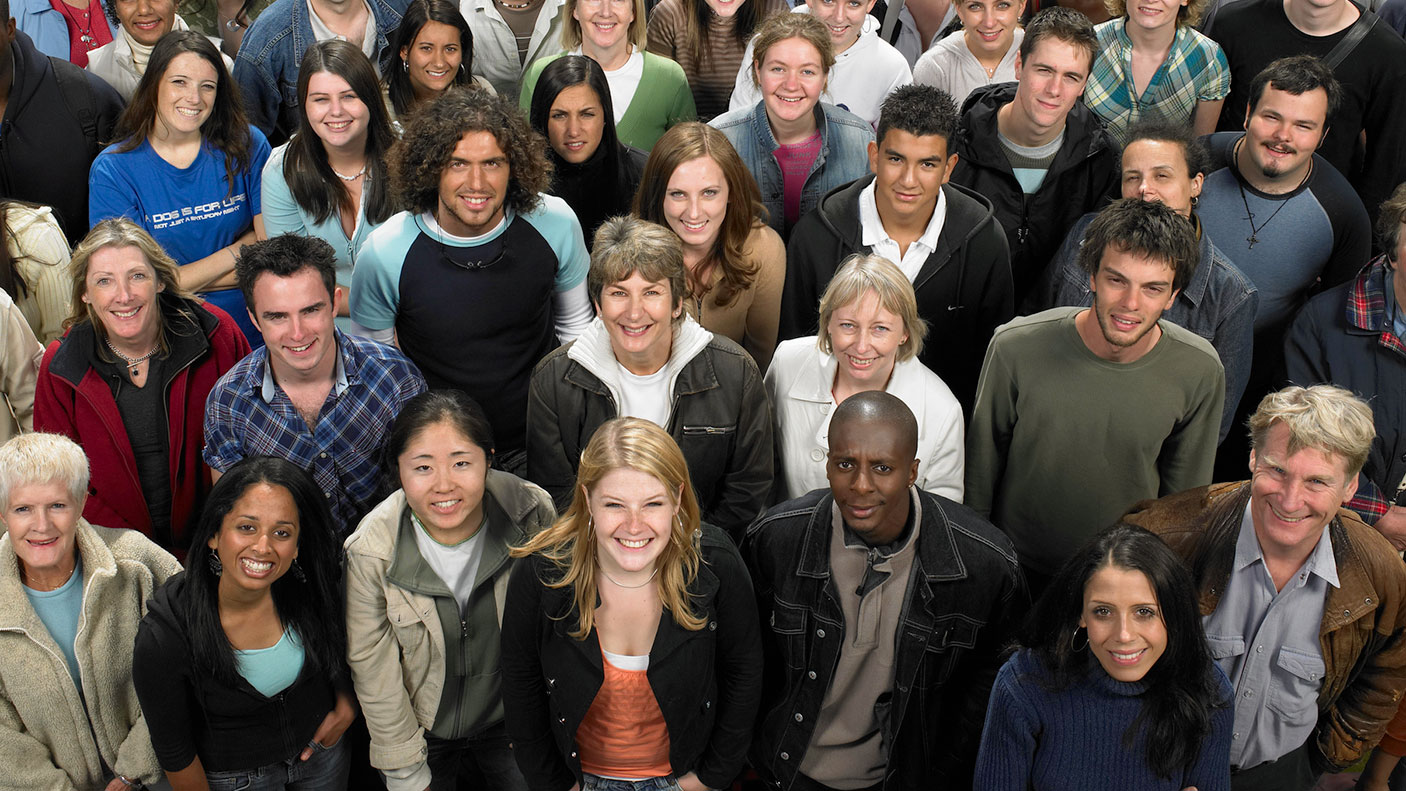 A group of people standing close together and looking up at the camera