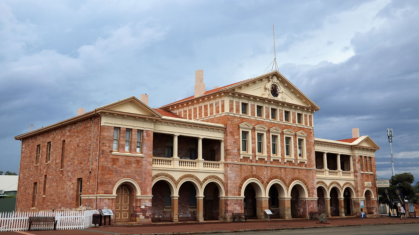 The Coolgardie town hall with a dark and stormy sky in the background