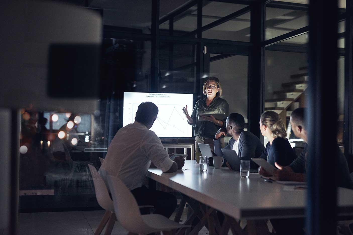 A group of professionals working in a library