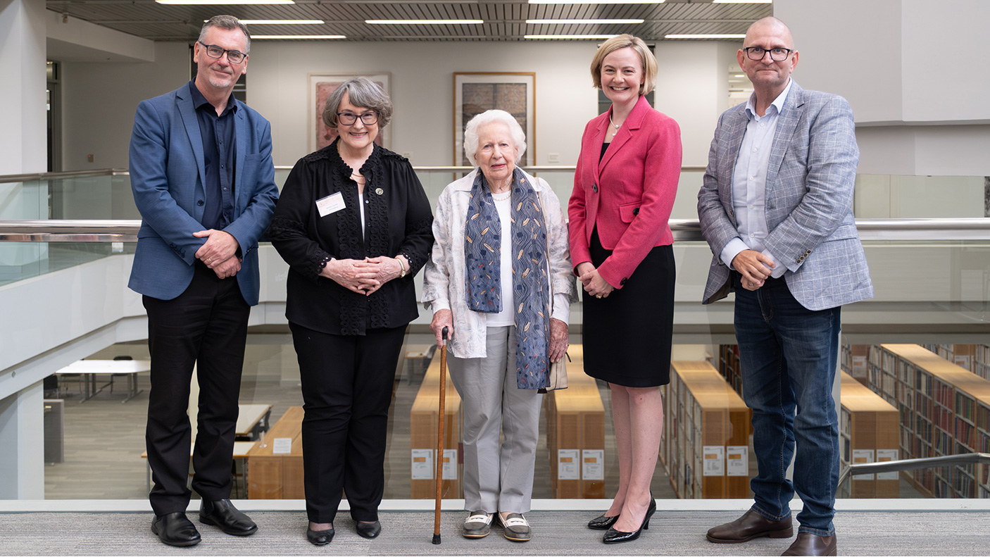 4 people stand next to Margaret Medcalfe
