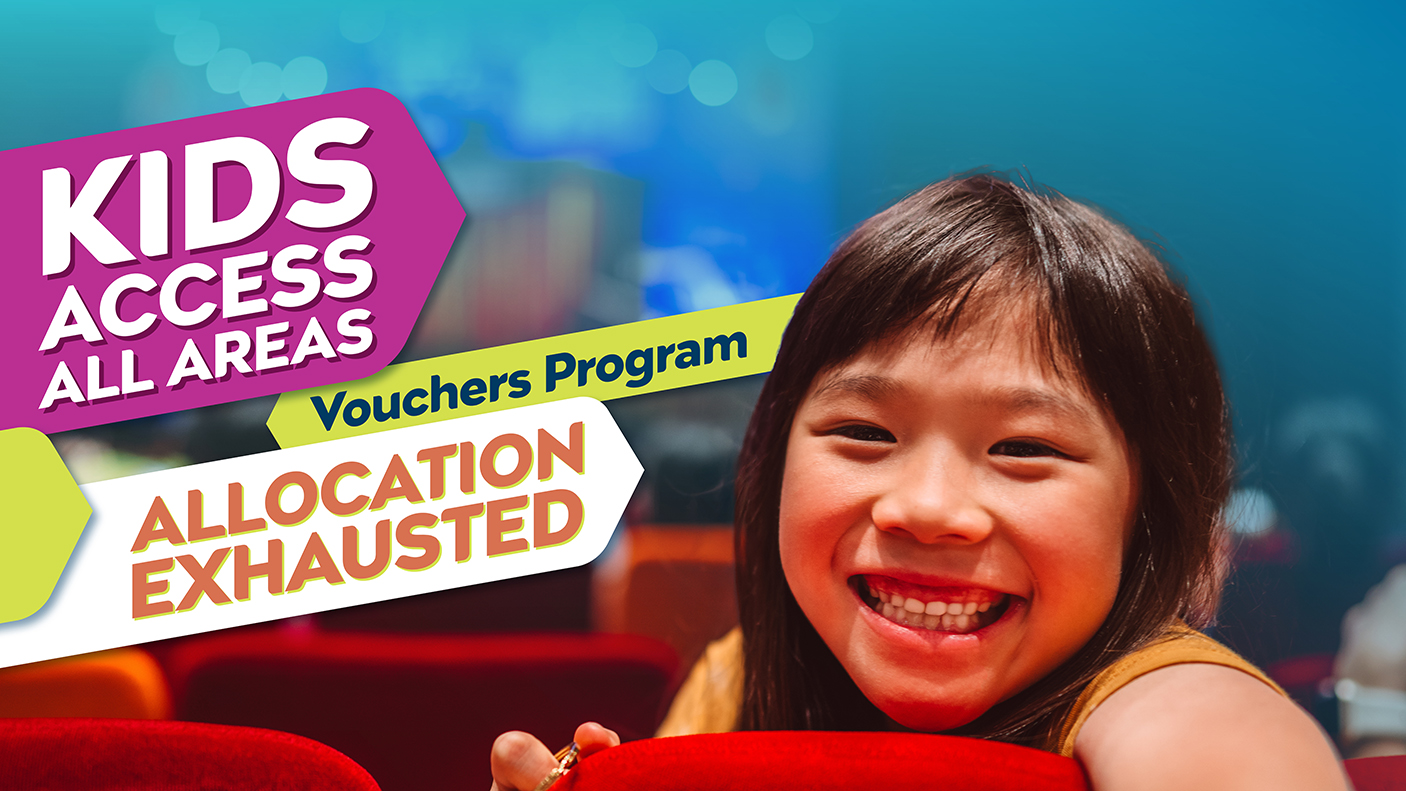 A smiling child in a theatre seat with the words, Kids Access All Areas Vouchers program allocation exhausted'