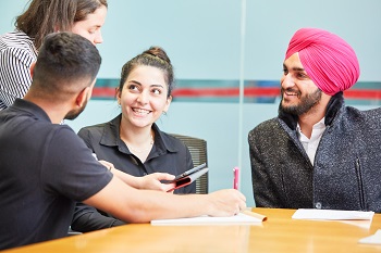 Interpreters Interpreters sitting at a desk