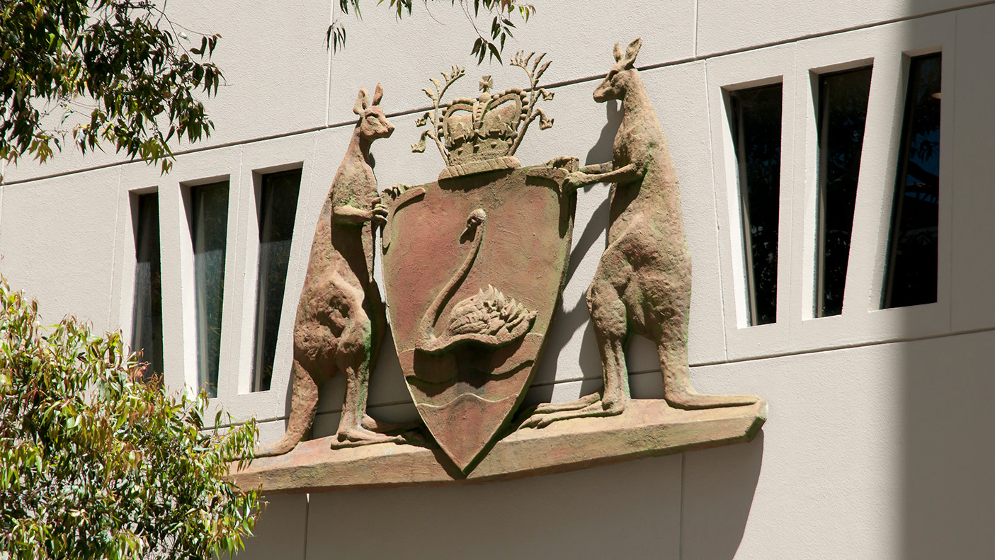 Close up of the WA state crest on a judicial building