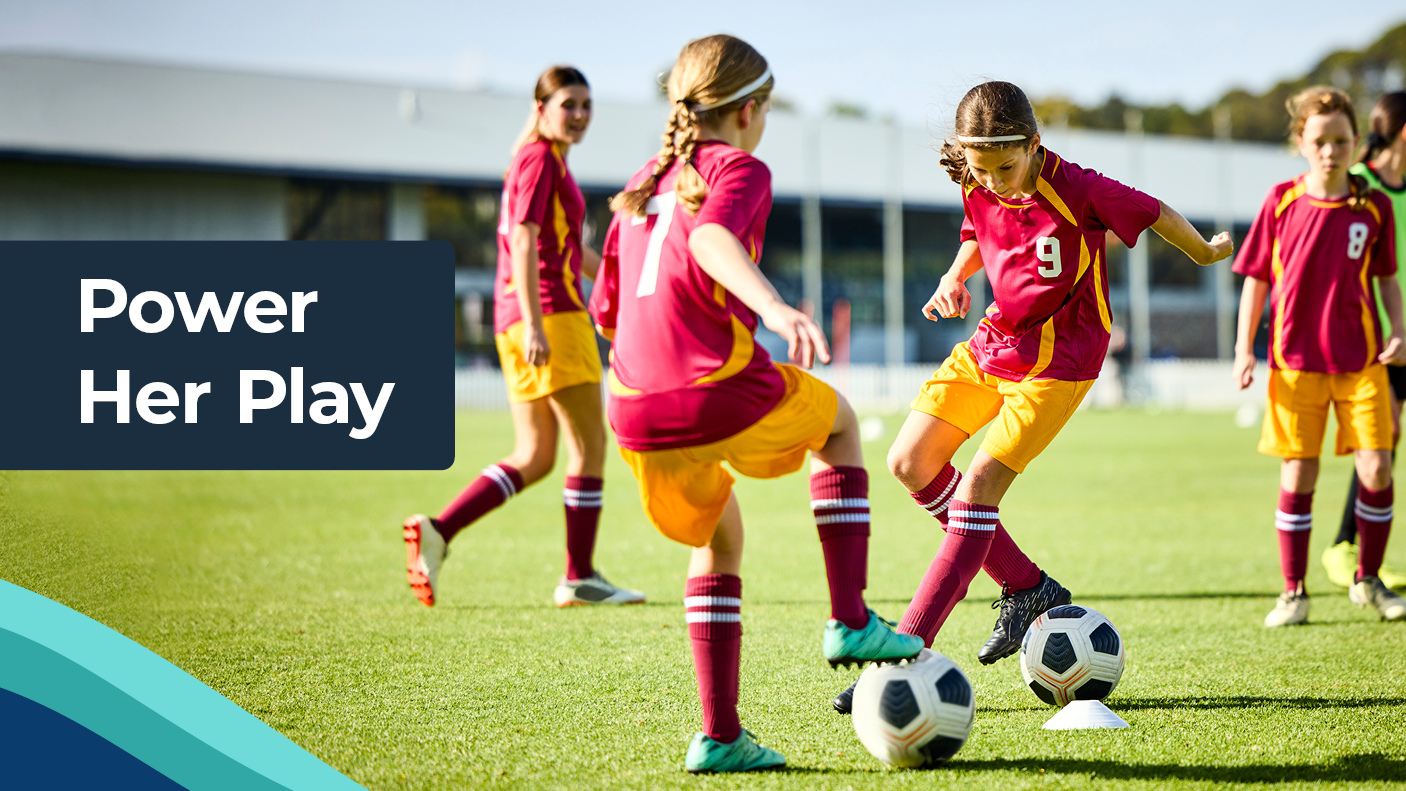 Girls playing soccer with text: Power Her Play