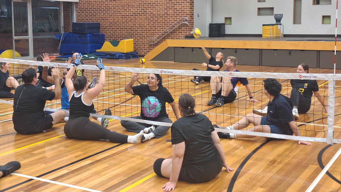An adaptive volley game in progress, on an indoor court