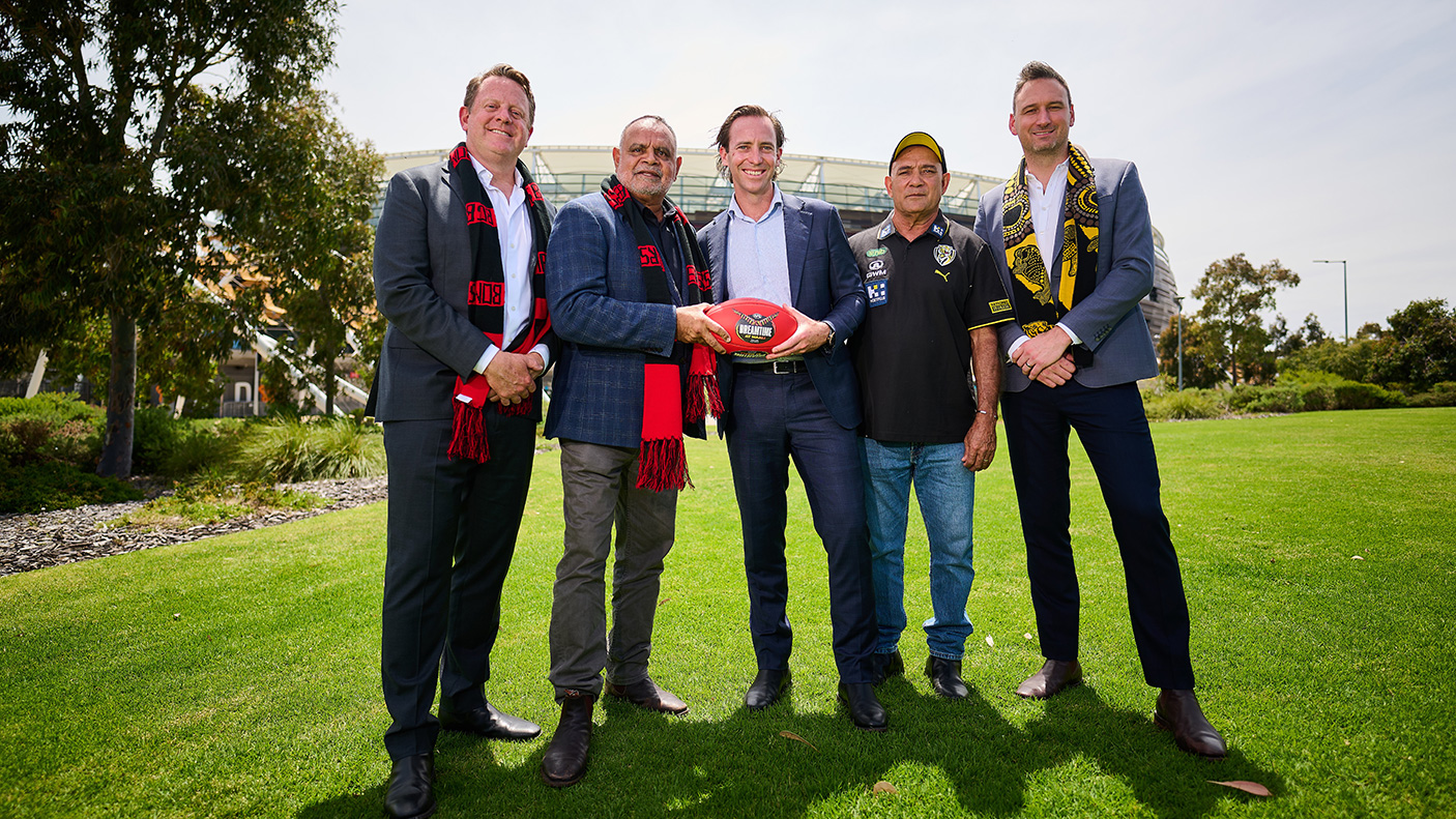 5 men with a football at Optus stadium