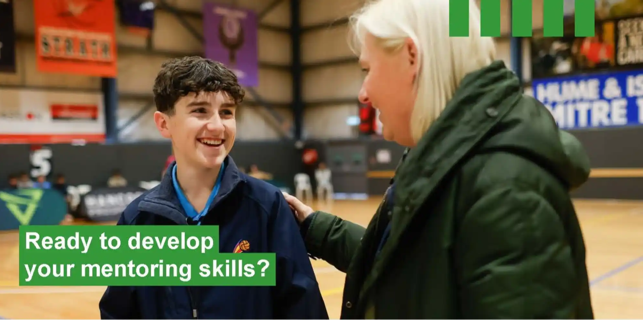 A coach and a teenage sports player talk in a indoor gymnasium. Text reads: Read to develop your mentoring skills?