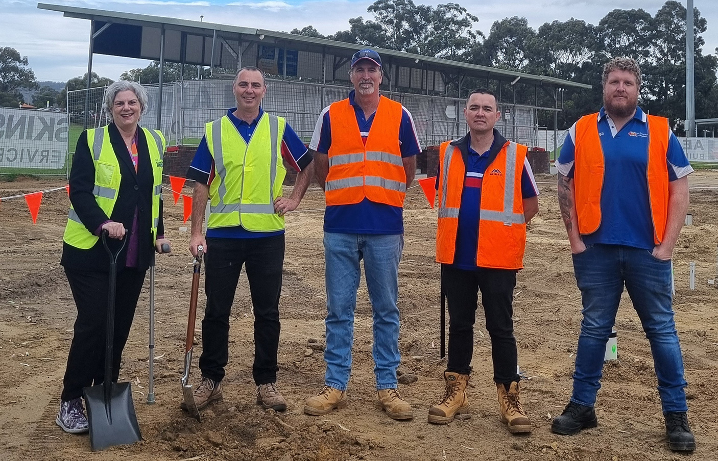 5 people in high vis vests on a construction site
