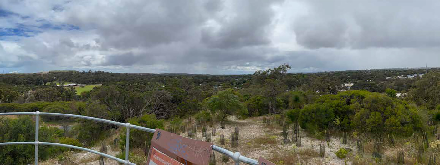 Wide angle view of the Kwinana Loop trail with storm clouds in the sky,