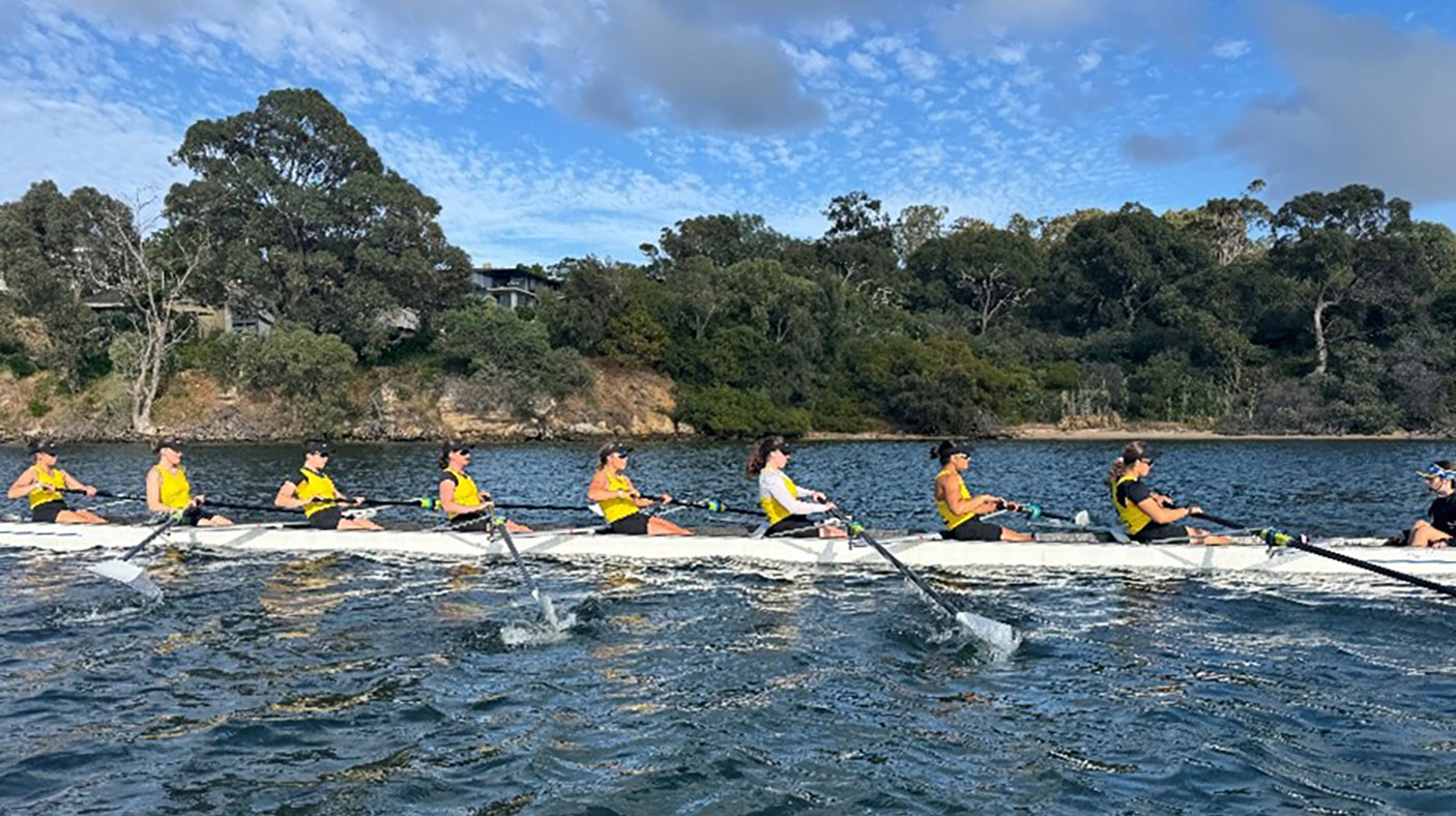 A team of rowers on the river
