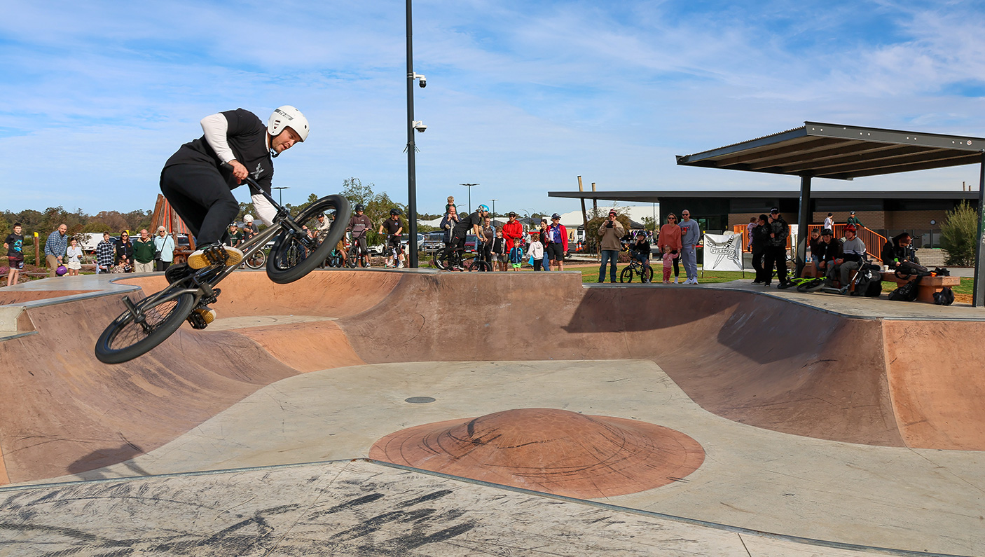 A person doing a jump on the BMX track at Dalyellup Library and Yoth Hub