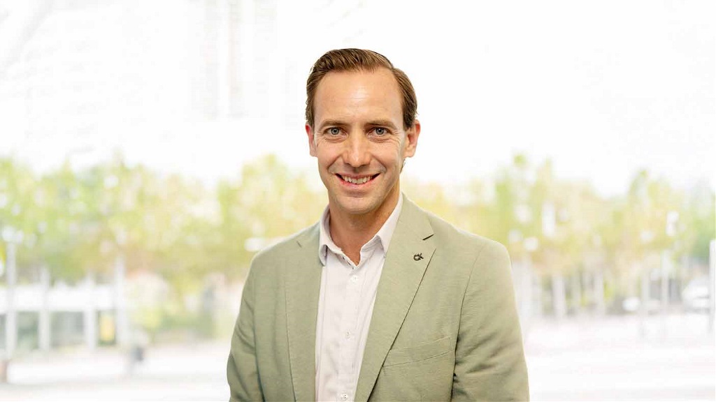 A portrait of Chad Anderson with a blurred background