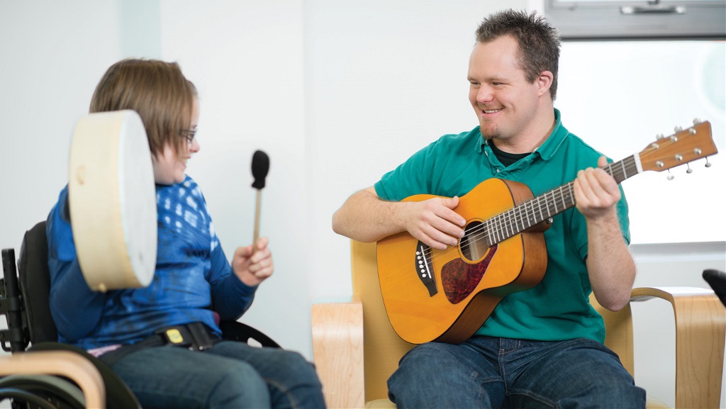 2 people play musical instruments